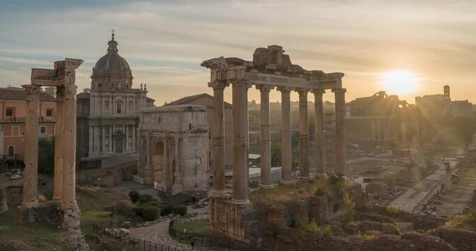 Morning time-lapse of historic Roman Forum ruins. Sunrise over Forum Romanum famous ancient travel landmark of Rome, Italy. Archaeological site and popular tourist attraction in center of the city.