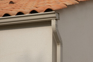 House rain gutter sandy beige modern waterproofing home corner roof facade