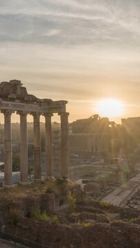 Morning time-lapse of historic Roman Forum ruins. Sunrise over Forum Romanum famous ancient travel landmark of Rome, Italy. Archaeological site and popular tourist attraction in center of the city.