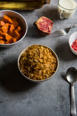 Ready to eat breakfast food cornflakes in a bowl. View from top, selective focus.