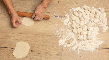 Rolling out the dough with your hands.