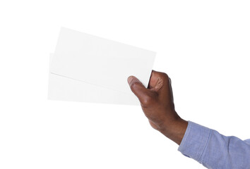Fototapeta premium African American man holding flyers on white background, closeup. Mockup for design