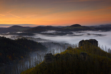 Obraz premium Misty morning. Czech typical autumn landscape. Hills and villages with foggy morning. Bohemian Switzerland park, Jetrichovice, Ceske Svycarsko.