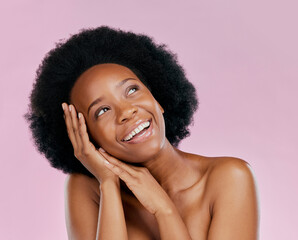 Thinking, skincare or happy black woman with afro from dermatology, salon cosmetics or wellness. Smile, face or African model with natural beauty or self love isolated on a pink background in studio