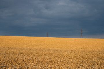 dark clouds over fields