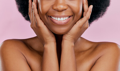 Closeup, beauty and black woman, smile and mouth with dermatology against a studio background....