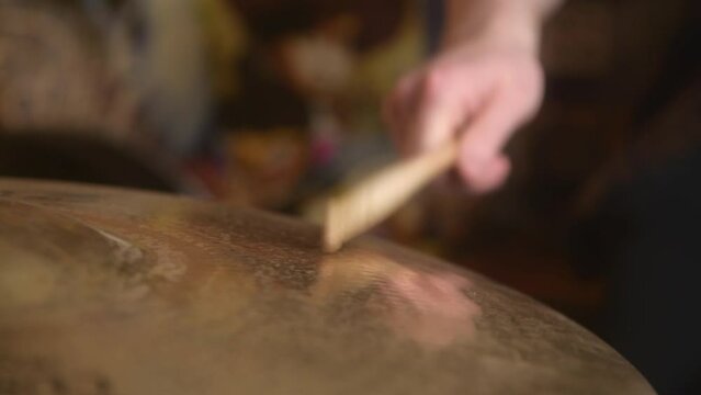 Drummer playing the cymbals during a drum recording session in the studio