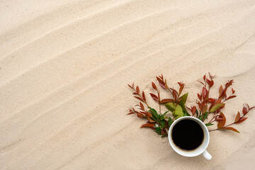 Cup coffee on the sand