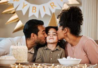Father, mother and child at birthday party, kiss and happy with celebration, care and bonding in family house. Dad, mom and young kid with event, excited face and love together at table in apartment