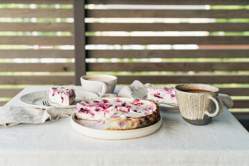 Baked homemade cottage cheese casserole. Morning breakfast with cottage cheese casserole with berries and coffee