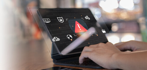 Developer programmer using laptop with warning triangle sign for alert found error and maintenance...