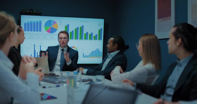 business meeting of multiethnic people in office, boss and employees communicating, 4K, Prores
