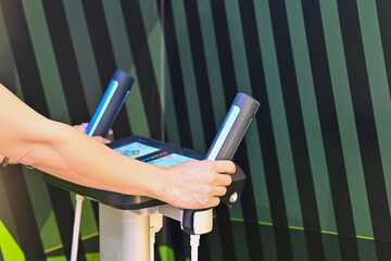 Woman hand touch the weight body composition for monitor her fat body analysis at gym fitness....