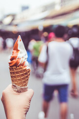 Double Delight: Hand Holding Two-Tone Ice Cream