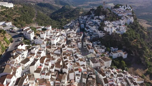 Spectacular view from drone of old white-washed houses of clifftop village of Casares at sunny day, Spain