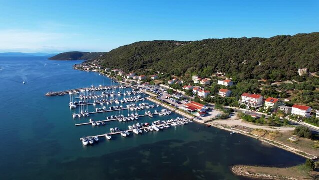 Supetarska Draga - Island Rab - Croatia - marina - The drone rises above the bay and opens up an amazing view 