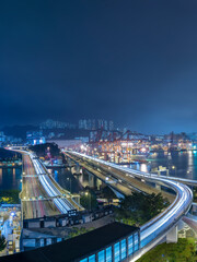 Fototapeta na wymiar Night Scenery of Cargor Port and Highway in Hong Kong City