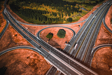 Clover leaf shaped highway interchange from drone pov