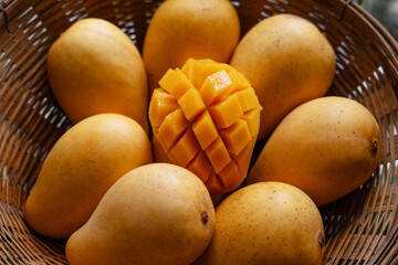 yellow ripe mangoes in basket