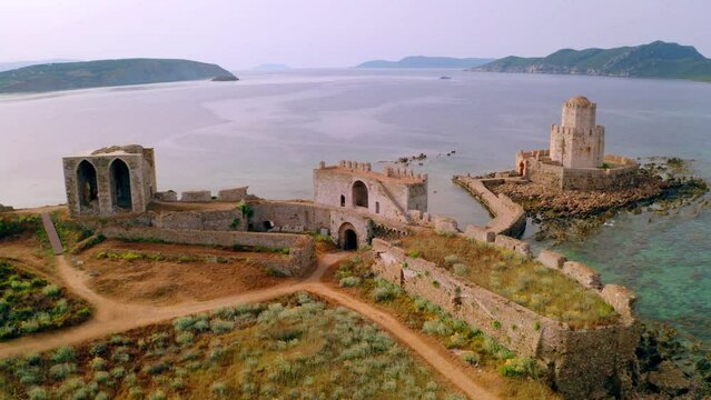4k drone forward video (Ultra High Definition) of old Methoni Castle. Aerial seascape of Ionian sea. Beautiful outdoor scene of Peloponnese peninsula, Greece, Europe. Traveling concept background.