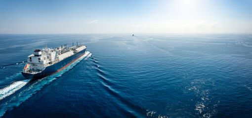 A big LNG tanker ship travelling over the calm, blue ocean as a concept for international fuel...