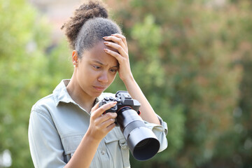 Black photographer complaining checking photos on camera