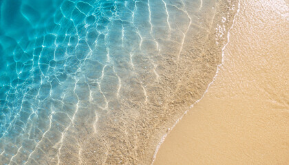 abstract sand beach from above with light blue transparent water wave and sun lights, summer...