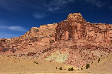 Fototapeta na wymiar dramatic red rock formations on a sunny winter day in the san rafael river canyon along the buckhorn draw scenic byway in the northern san rafael swell near green river, utah 
