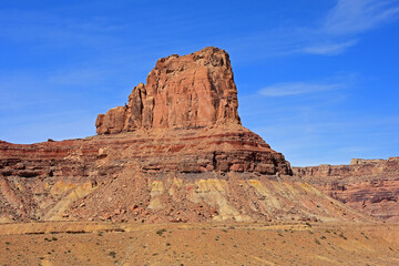 Fototapeta premium the colorful red rock butte of assembly hall peak on a sunny winter day along the buckhorn draw scenic backway in the northern san rafael swell near green river, utah 