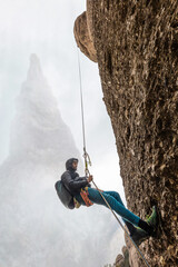 boy climbing on the mountain, boy rappelling on the mountain, enjoy outdoors