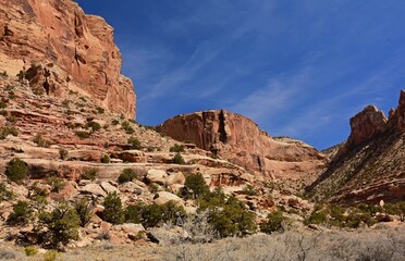Fototapeta na wymiar dramatic red rock formations on a sunny winter day in the san rafael river canyon along the buckhorn draw scenic byway in the northern san rafael swell near green river, utah 