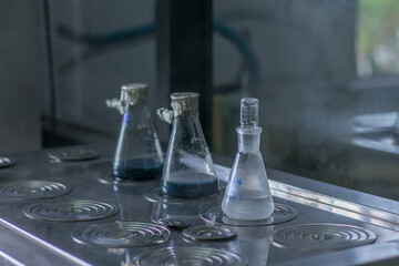 Laboratory glassware on the gas burner. Chemical laboratory equipment.