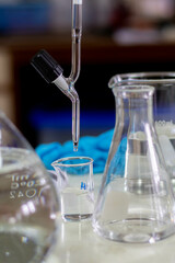 Laboratory glassware on the gas burner. Chemical laboratory equipment.