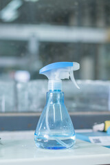 Spray bottle for cleaning and disinfection of the surface. Cleaning of the workplace.