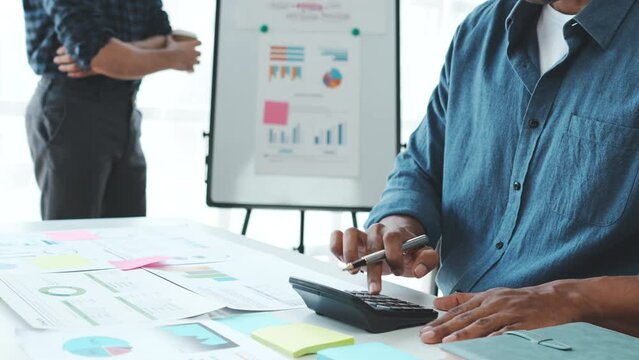 Business adviser analyzing financial figures denoting the progress in the work of the company.