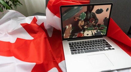 Man betting on sports using laptop at table, closeup. Bookmaker website on screen