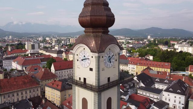 Aerial approaching clock tower of Klagenfurt Cathedral, Austria