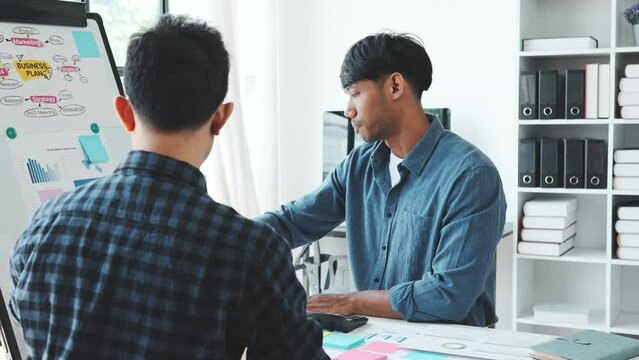 Business adviser analyzing financial figures denoting the progress in the work of the company.