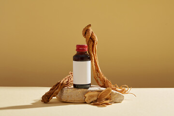 Mockup scene for advertising product with ingredient from herbal. A bottle unlabeled on stone podium, angelica sinensis root and rhizoma atractylodis macrocephalae displayed on brown background. - obrazy, fototapety, plakaty