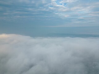 Landscape aerial view of the city skyline with white clouds