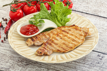 Grilled pork steak with ketchup