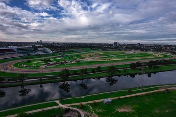 Aerial large green horse racing track next to a river, Flemington Melbourne