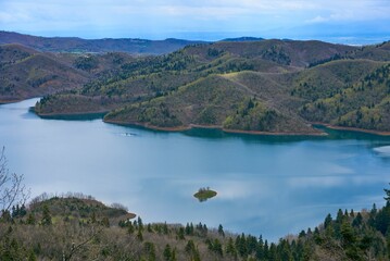 Smaller section of Lake Plastiras surrounded by green hills. Karditsa, Greece.