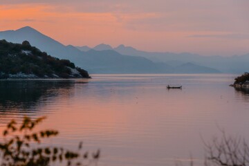 Beautiful shot of a kayak in a lake during a sunset