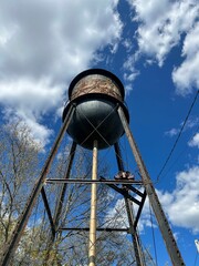 Vertical view of an old water tower in Fremont, New Hampshire