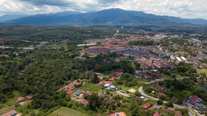 Fototapeta na wymiar Aerial view of Kuala Kangsar town near the mountains in Malaysia.