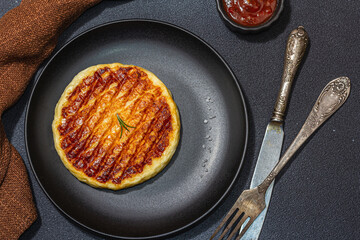 Grilled Halloumi cheese served on plate. Cutlery, traditional food for picnic or BBQ