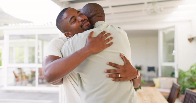 Senior African father, welcome and home with son, hug and love with kindness, bond and happy with care. Dad, black man and excited family with embrace, respect or conversation with smile in Cape Town