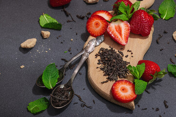 Refreshing summer drink. Dry tea leaves, fresh fruit and herbs. Set of ingredients for cooking tea