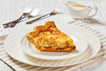quiche with cheese and bacon filling on plate